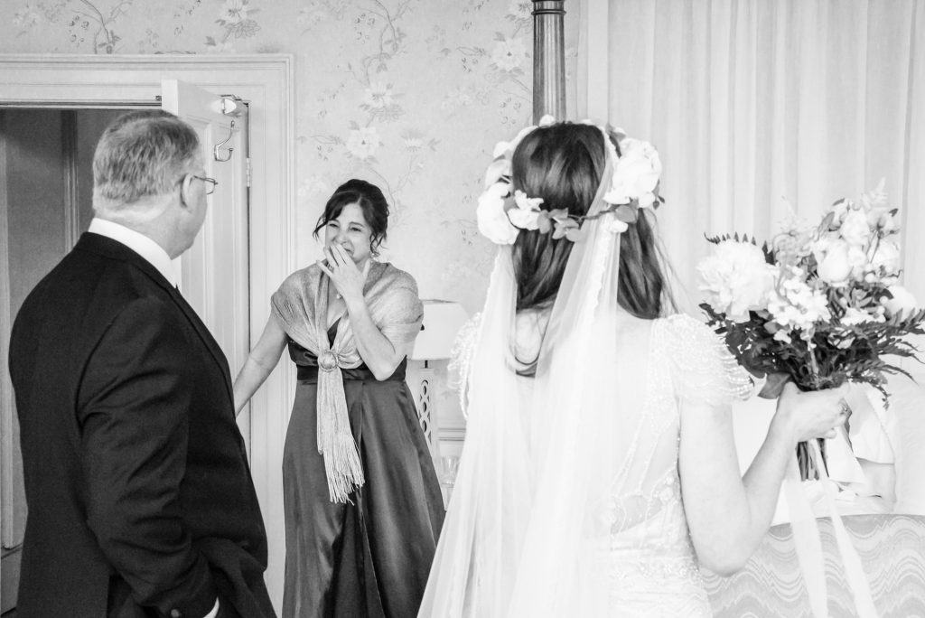 Parents’ emotional reaction during first look with bride at Drenagh House Estate wedding