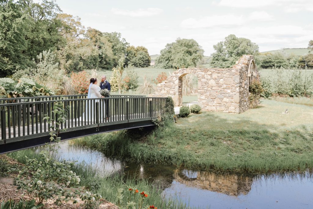 Bride and groom embracing during romantic wedding portraits in Northern Ireland Millbrook Lodge Ballynahinch