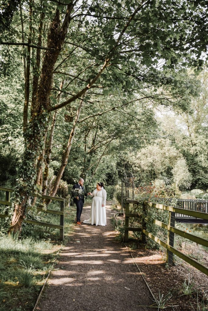 Bride and groom embracing during romantic wedding portraits in Northern Ireland Millbrook Lodge Ballynahinch