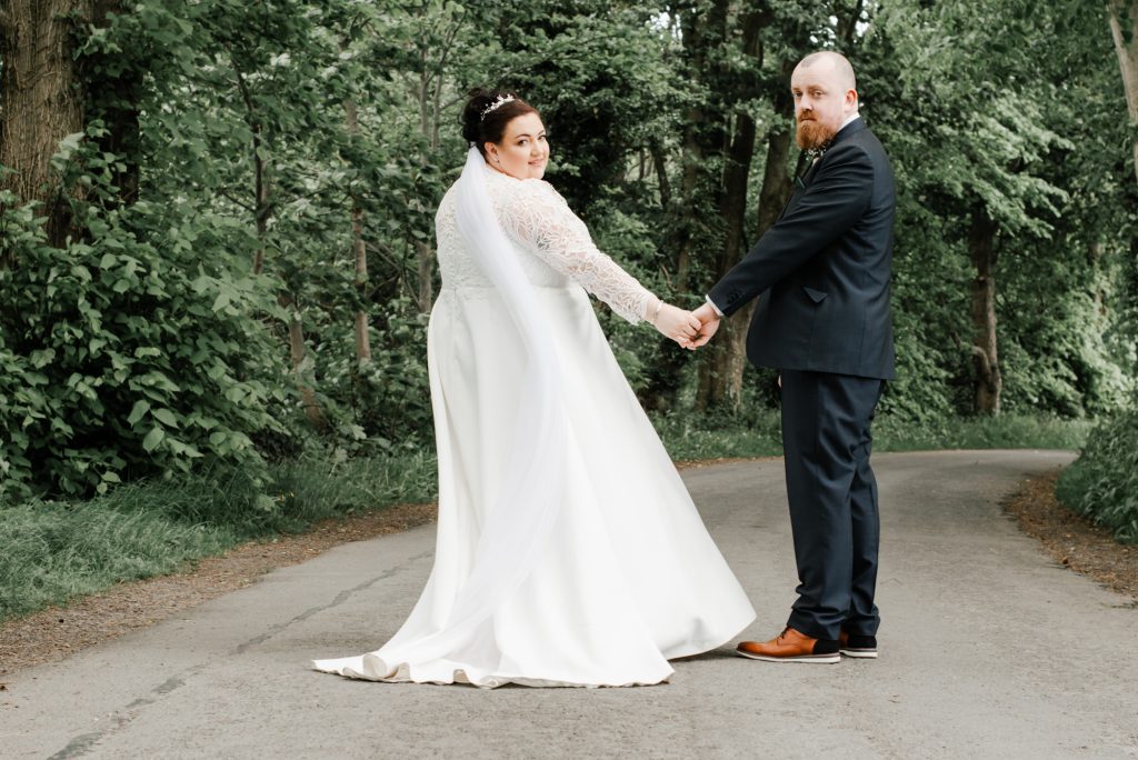 Bride and groom embracing during romantic wedding portraits in Northern Ireland Dundrum