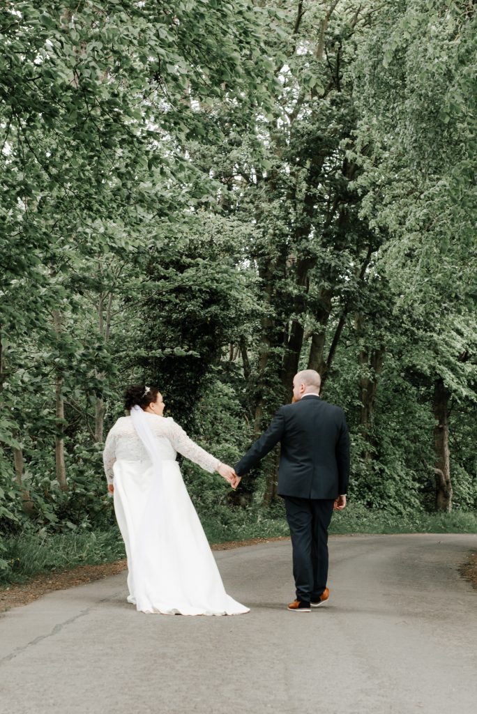 Bride and groom embracing during romantic wedding portraits in Northern Ireland Millbrook Lodge Ballynahinch