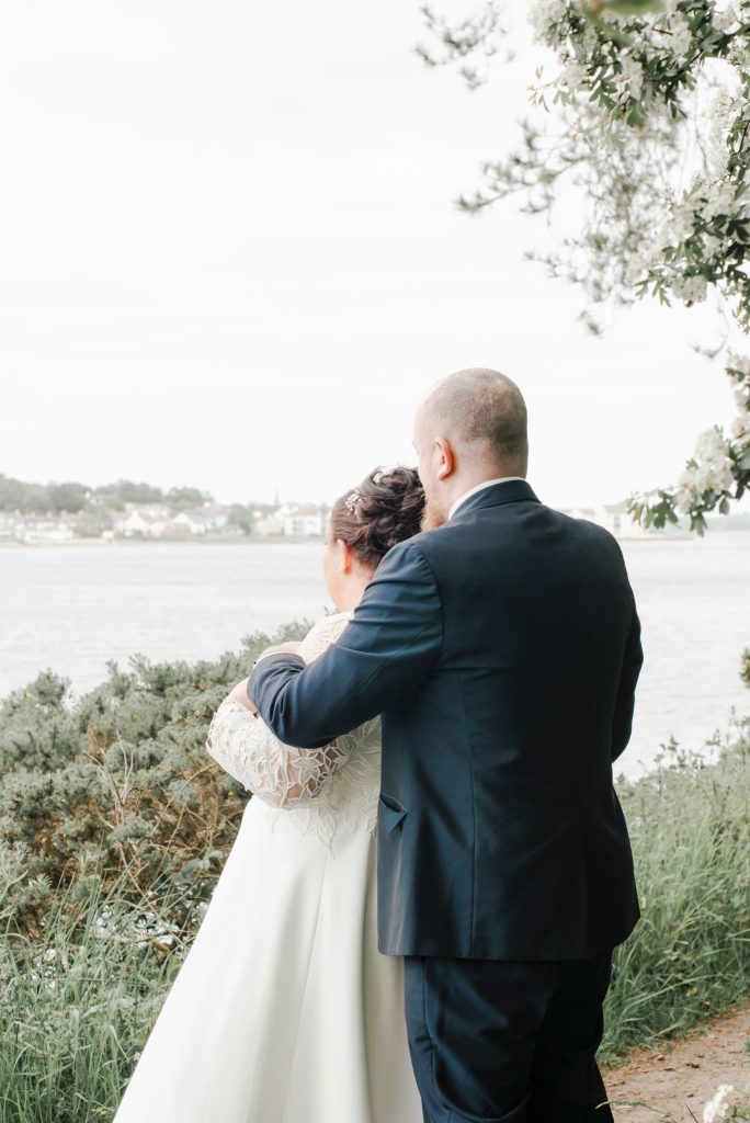 Bride and groom embracing during romantic wedding portraits in Northern Ireland Dundrum