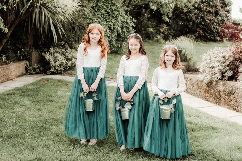 Flower girls outside at the wedding day