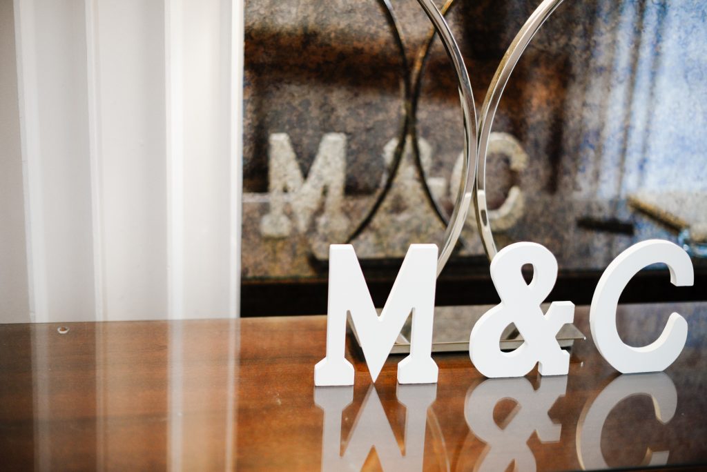 Bride's and groom's wooden letter initials at their reception at Millbrook Lodge Ballynahinch