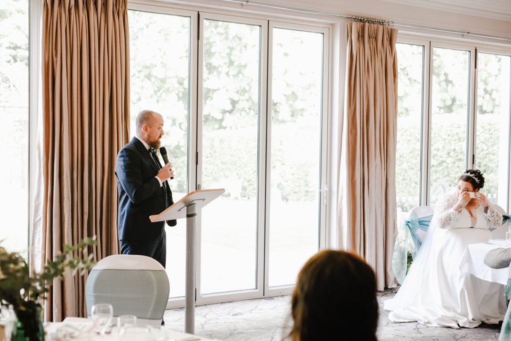 Bride emracing with tears a special moment of groom's speech at Millbrook Lodge