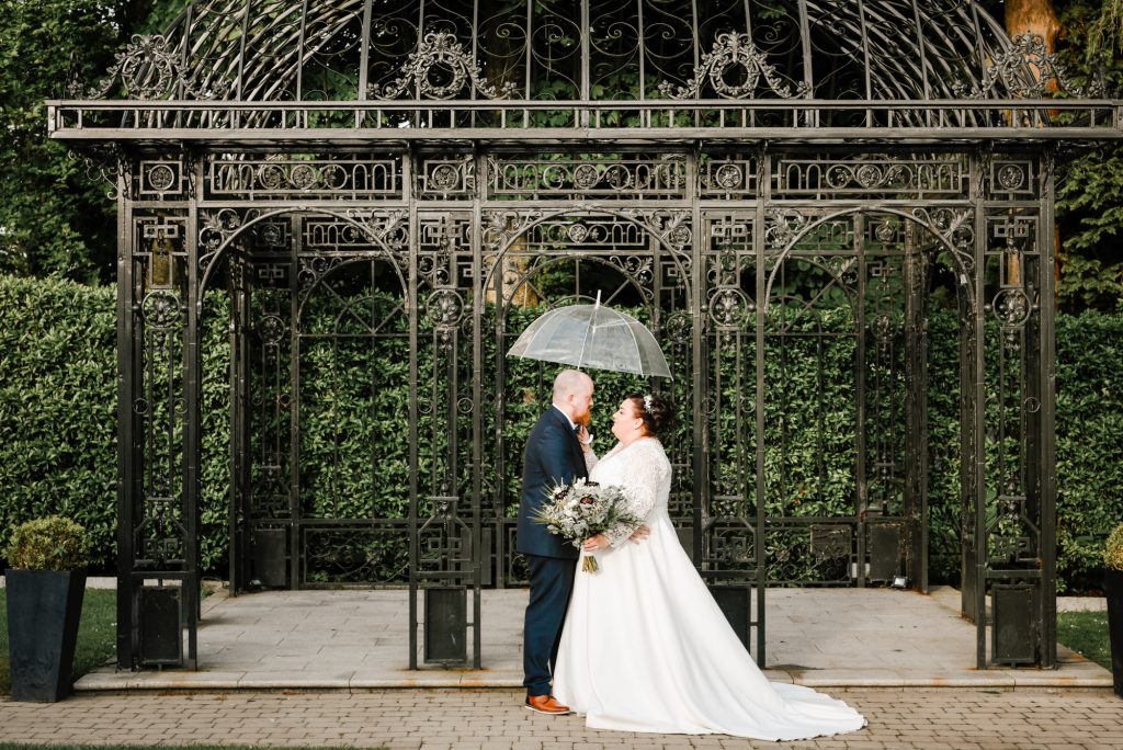 Bride and groom embracing during romantic wedding portraits in Northern Ireland Millbrook Lodge Ballynahinch